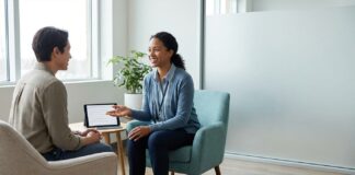 Cocaine Addiction Symptoms and When to Get Help Cocaine addiction symptoms and when to get help — supportive healthcare professional talking with patient in a calm clinic setting