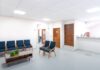 Medicaid Now Covers Residential Addiction Treatment in Most States. Here Is What Changed. A bright, empty medical waiting room with rows of modern seating, representing residential treatment capacity paid for through state Medicaid programs.