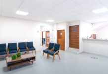 Medicaid Now Covers Residential Addiction Treatment in Most States. Here Is What Changed. A bright, empty medical waiting room with rows of modern seating, representing residential treatment capacity paid for through state Medicaid programs.