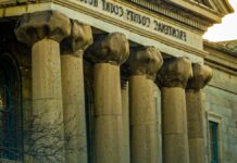 States Hold Billions in Opioid Settlement Money. No National Rule Requires Them to Say Where It Went. A courthouse exterior, representing the litigation that produced the national opioid settlements now being paid out to state and local governments.