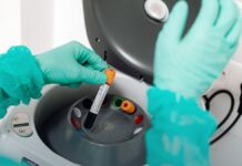 Stimulants Were Involved in 59 Percent of Overdose Deaths. Most Also Involved an Opioid. A gloved laboratory worker handles sample vials during testing.