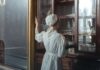 Benzodiazepine Withdrawal: Timeline, Protracted Symptoms and Taper Rates A pharmacy worker handling packaged medication behind a counter.