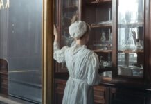 Benzodiazepine Withdrawal: Timeline, Protracted Symptoms and Taper Rates A pharmacy worker handling packaged medication behind a counter.