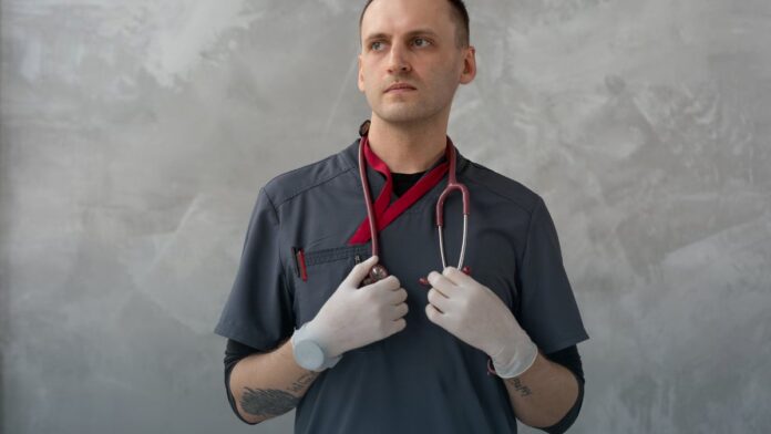 A stethoscope resting on a clinical surface.