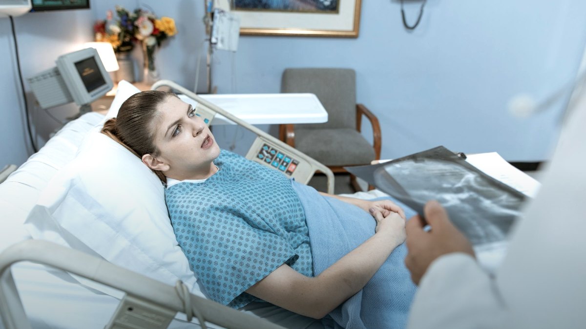A hospital bed and monitoring equipment in a quiet clinical room.