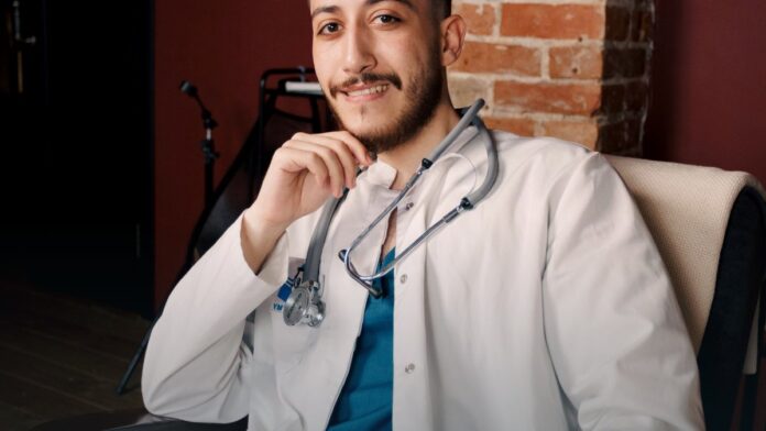 A clinician reviewing information in a medical office.